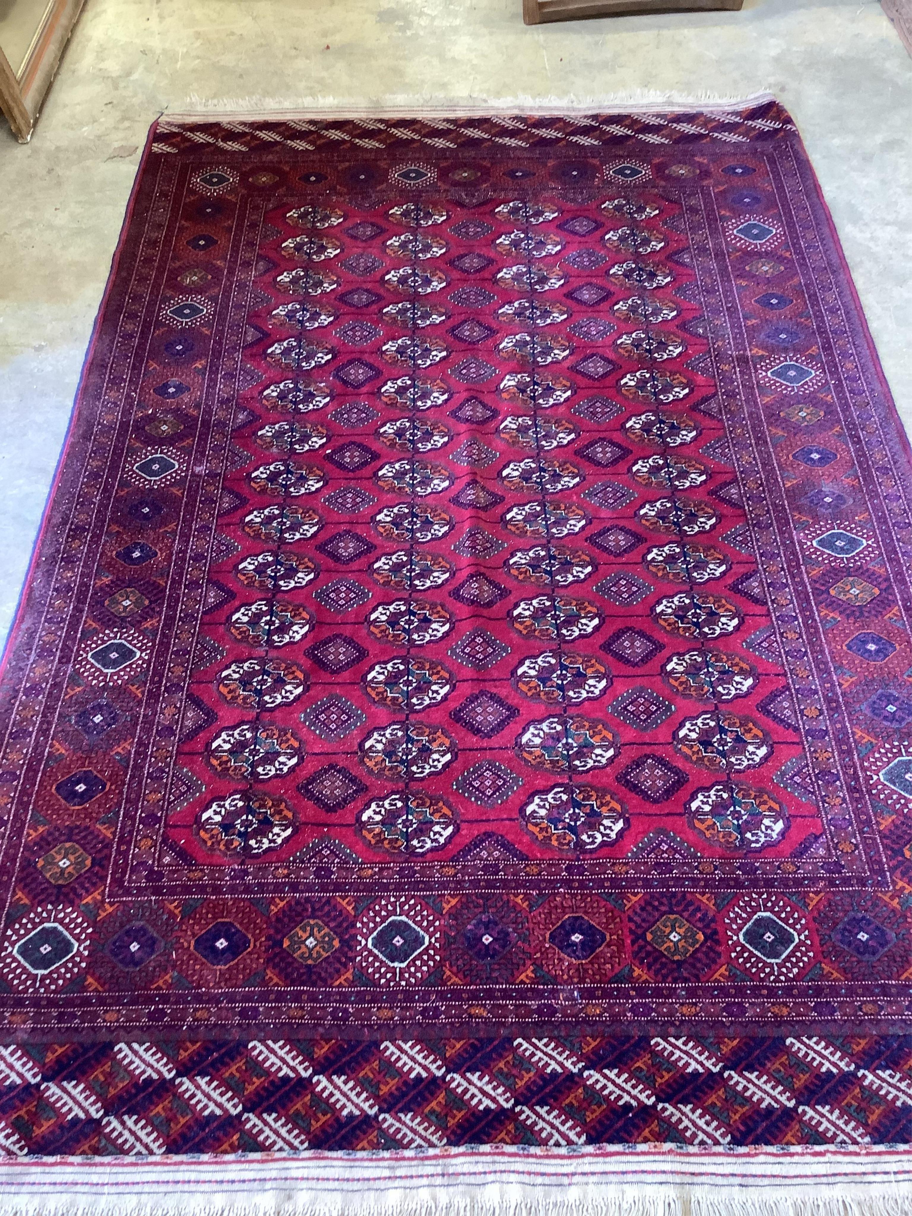 A modern Bokhara red ground rug, 253 x 165cm. Condition - good